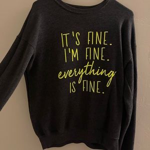 It’s fine. I’m fine. Everything is fine.  Woman’s medium sweater